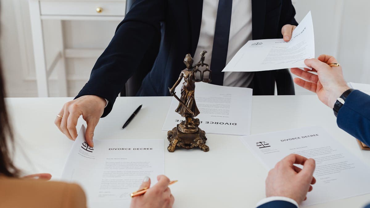Conveyancing solicitor reviewing property search documents at a desk