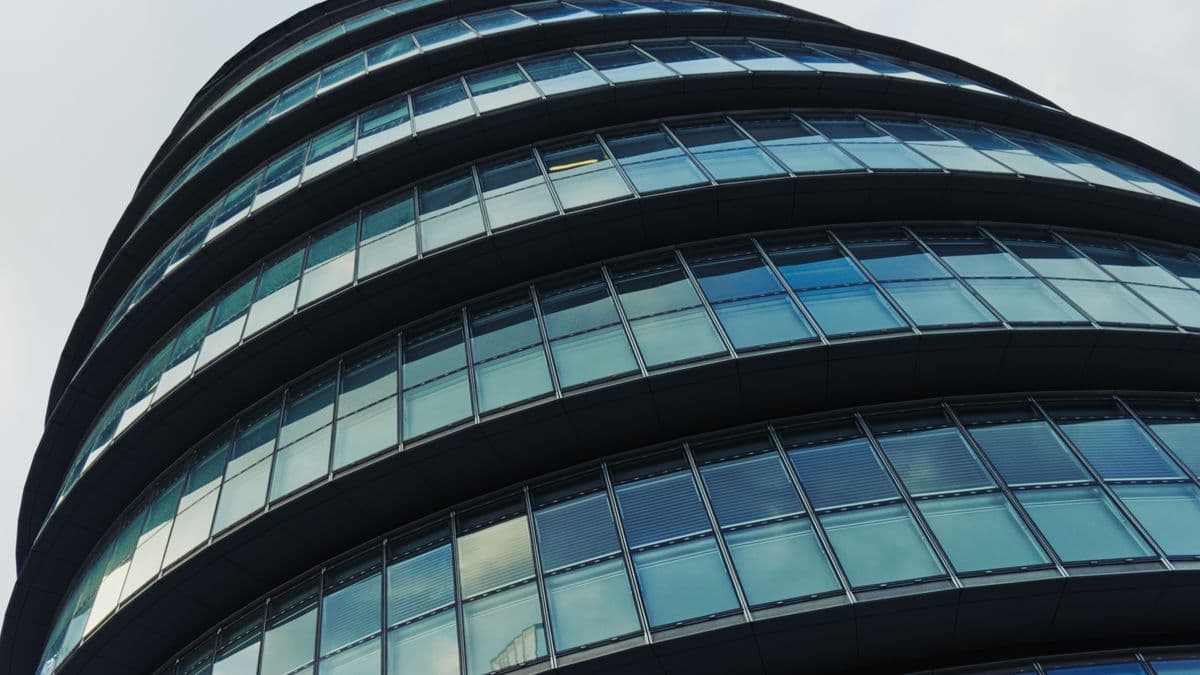 Council building exterior alongside search firm office, representing both search routes