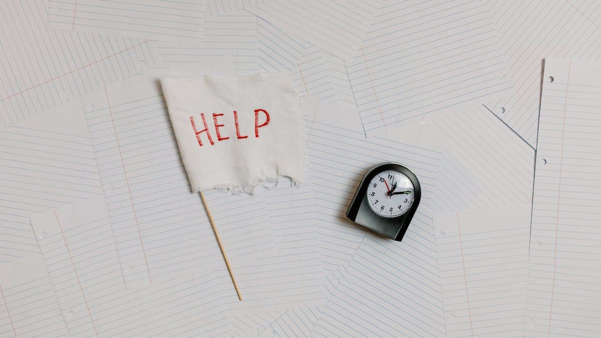 Conveyancer reviewing a service level agreement and property search documents at a desk