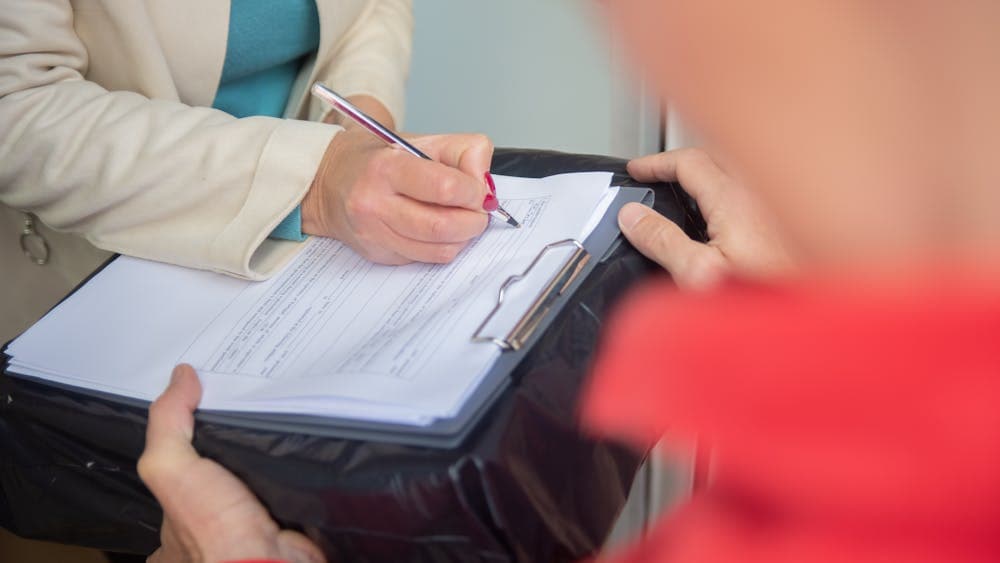 Conveyancer reading a service level agreement document