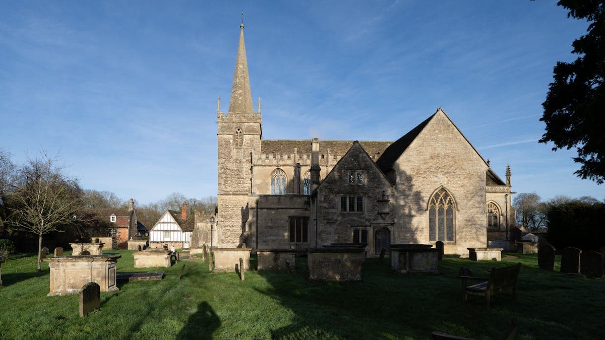 Stone parish church with a chancel and tower in the English countryside