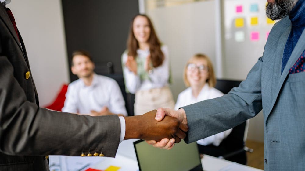 Personal search firm owners meeting around a table