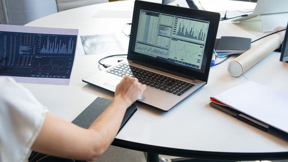 Property search report being prepared on a laptop